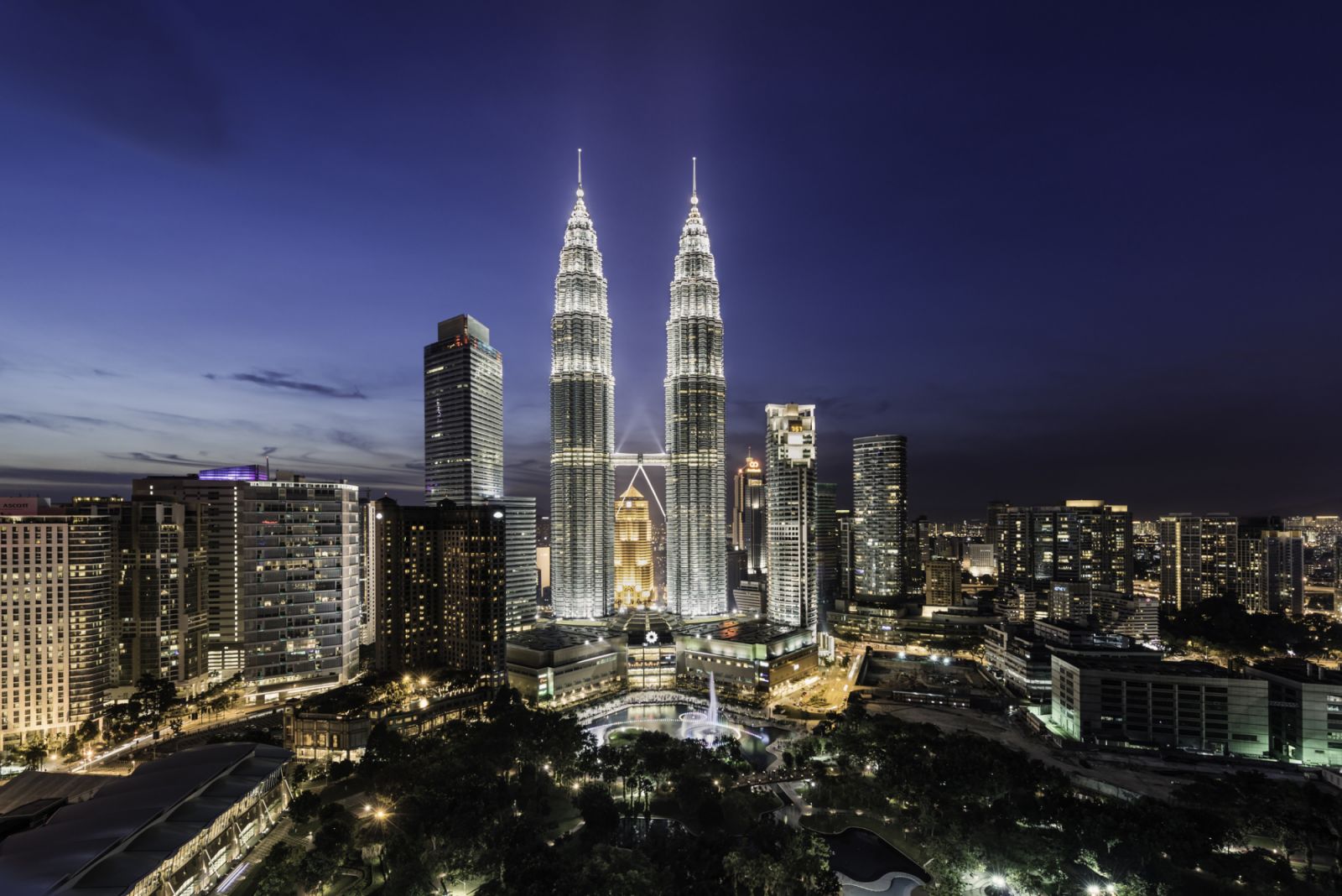 Malaysia, Kuala Lumpur, the Petronas Towers at dusk, elevated view.